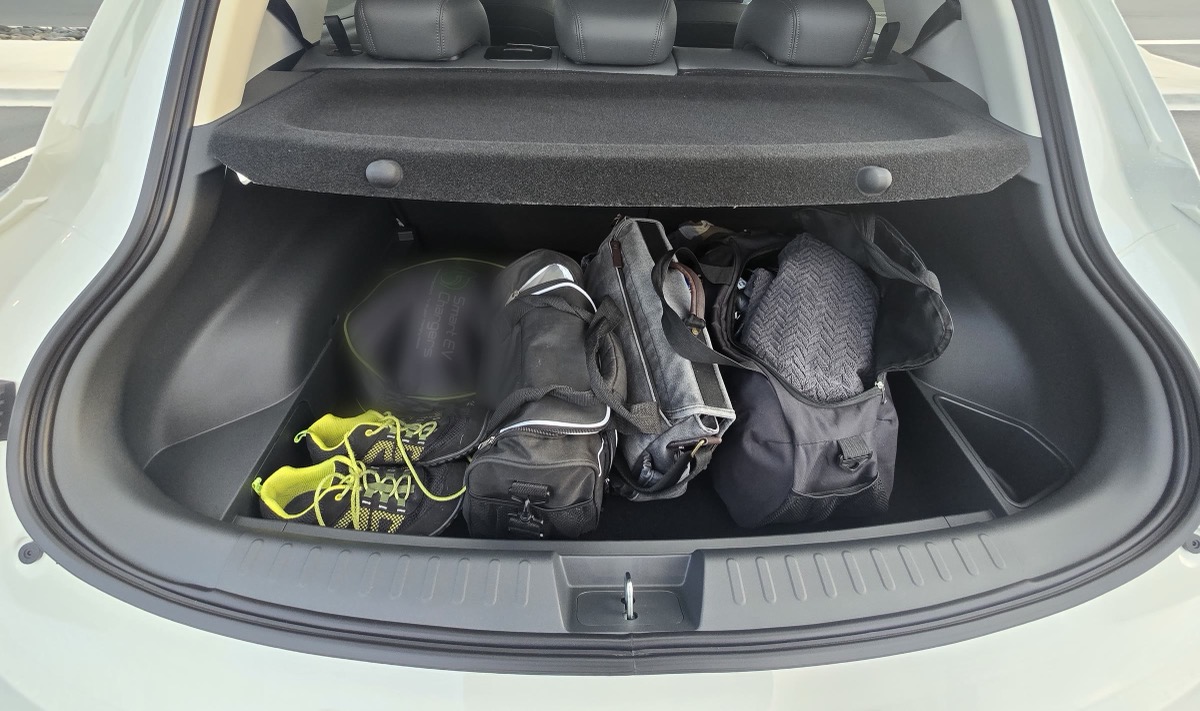 The Ora 5's boot with four gym and travel bags in it.